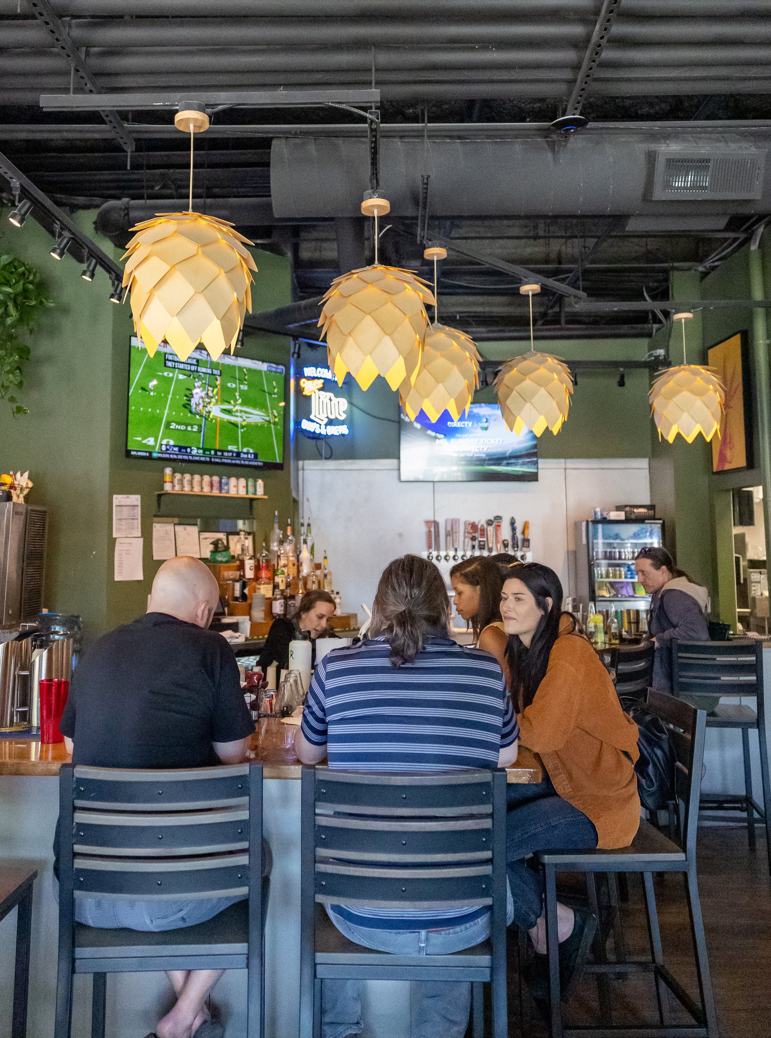 Garage Doors open by the bar with Football on the TVs.jpg